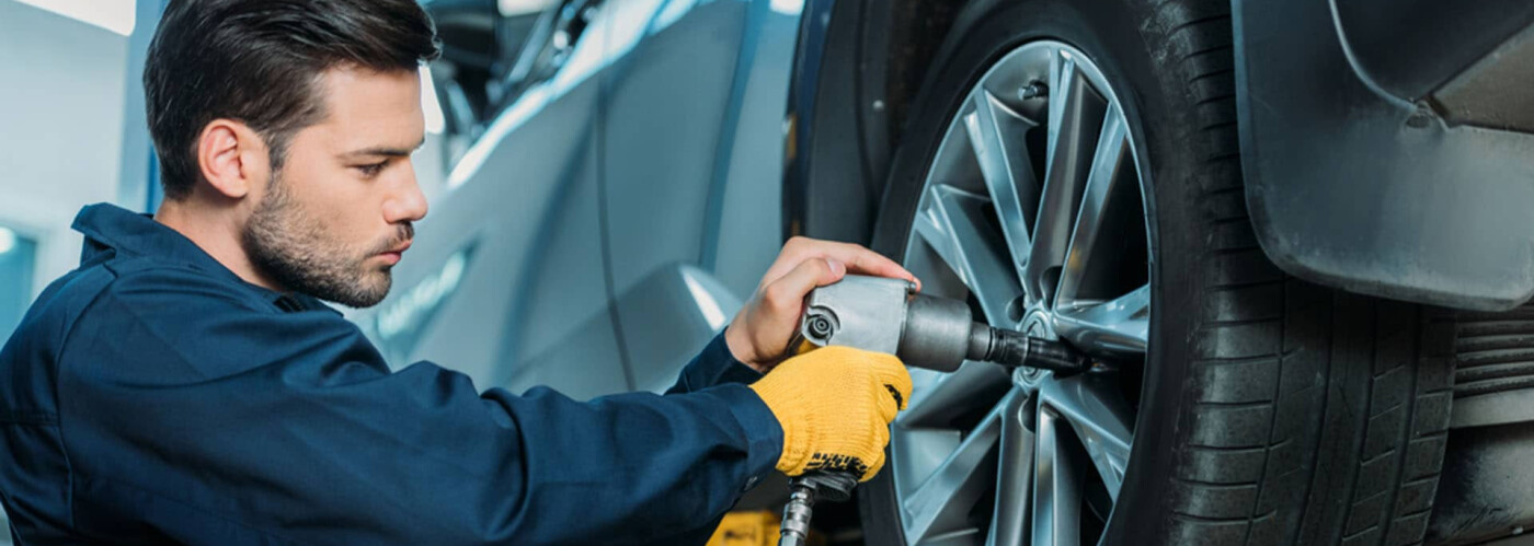 Mechanic with Tires