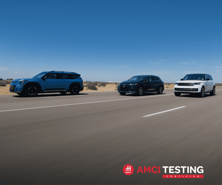 EV9 vehicles driving on a desert road